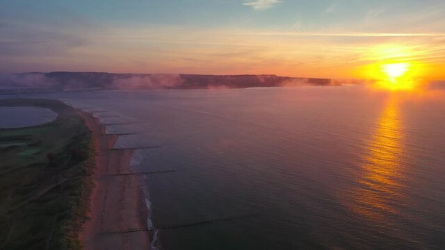 Sunrise over Exmouth and Dawlish Warren Beach from a drone, Devon, England, Europe

