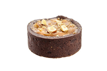 Mini caramel tart with hazelnuts isolated on white