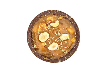 Mini caramel tart with hazelnuts isolated on white