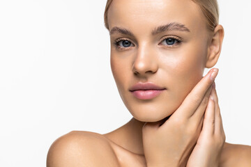 Portrait of blonde with the ideal skin, isolated on a white background. Skin care