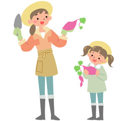 芋掘りをする親子