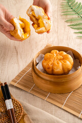 Fried Salted Egg Baozi or Bakpao is a type of yeast-leavened filled bun in various Chinese cuisines.