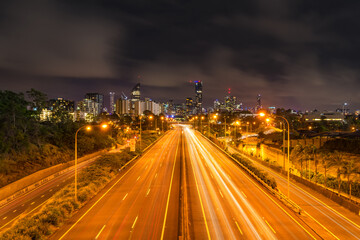 Fototapeta na wymiar Brisbane City, Queensland Australia Downtown Region Freeway Highway Lights streaks cars vehicle headed to city