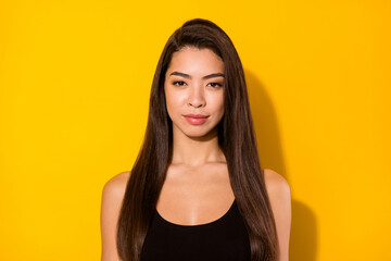 Fototapeta premium Photo of cute brunette hairdo lady wear black top isolated on vivid yellow color background