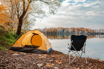 tent at the beach of the lake autumn fall season