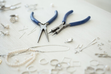 A set of accessories and tools for making jewelry. Needlework and hand made.