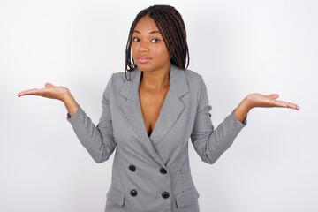Puzzled and clueless MODEL with arms out, shrugging shoulders, saying: who cares, so what, I don't...