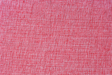 simple red linen fabric texture used as background. decorative woven cotton jute cloth.  Christmas red decorative fabric