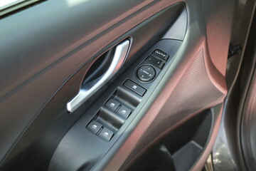 Obraz na płótnie Canvas Control panel in the car door.