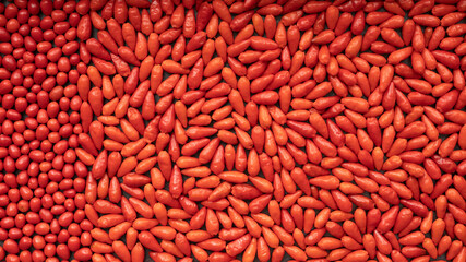 Little chili peppers background. Small red ripe hot chili pepper texture.