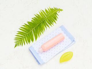 Towel and women's accessories for bath procedures on a white background.