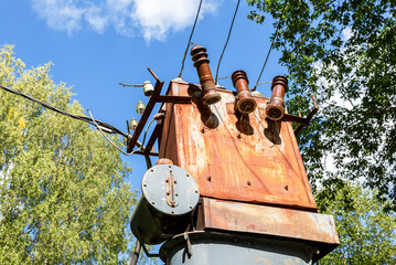 Old voltage power transformer substation at the countryside