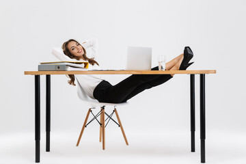 Attractive young businesswoman working isolated