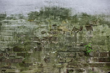 Ancient mossy monastery wall, brickwork, blurred background