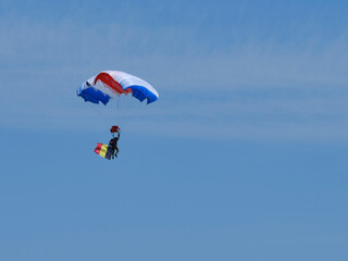 Parachutist and Belgium flag in flight