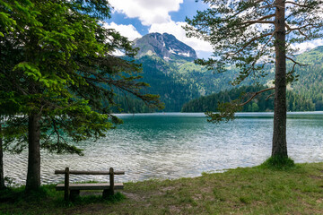 Wooden bench near Glacial Black Lake. Durmitor National Park. Montenegro