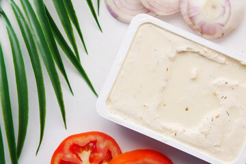 low fact cheese cream in a container on table,