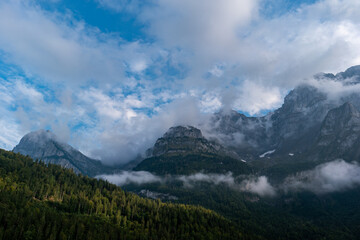 Fototapeta premium Grand scenic mountain vistas in the Swiss Alps. Summer, clouds, blue sky, no people.