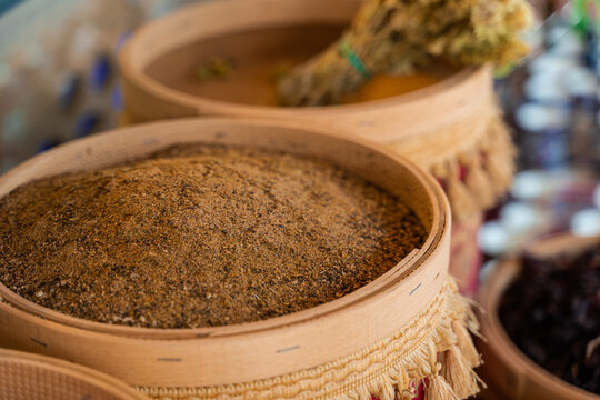 Assortment of Turkish spices and herbs in wooden bowls. Turkish market spices such as saffron, sumac and thyme. Cumin, rosemary and isot.