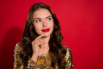 Photo of young curious lady look empty space wear gold dress isolated on red background