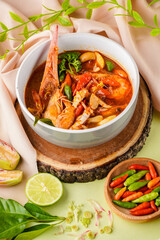 Tom yum or tom yam is a type of hot and sour Thai soup, usually cooked with shrimp (prawn). Tom yum has its origin in Thailand.