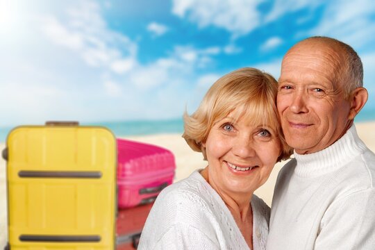 Portrait Of Smiling Married Senior Couple With Suitcases, Holiday Trip.