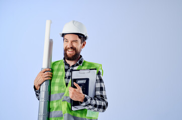 male worker with documents and drawings blueprints blue background