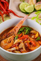 Tom yum or tom yam is a type of hot and sour Thai soup, usually cooked with shrimp (prawn). Tom yum has its origin in Thailand.