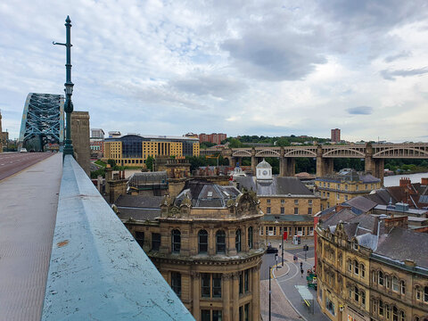 Old buildings in Newcastle pictured from a rusty Tyne bridge looking towards Gateshea