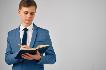 business man in suit writing on notepad work office manager