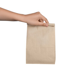 Woman holding paper bag on white background, closeup