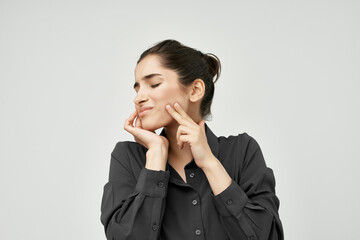brunette holding face dissatisfaction tooth pain health problems
