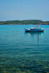 Fototapeta na wymiar Greek fishing boat in Aegean sea near Milos island, Greece