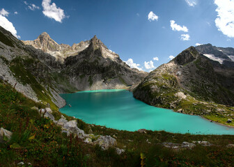 Naklejka na ściany i meble Beautiful alpine lake Klukhor in Dombai on the border of Russia and Abkhazia