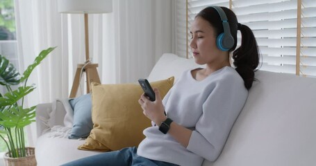 Asia teen girl people enjoy coffee in break time self relax happy joy with good song in online radio app sitting rest sleep at cozy sofa. Youth fun hobby indoor lazy zen life smile napping at home.