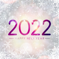Fogged glass 2022 sign on bokeh snowflakes background.