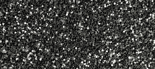 Black glitter texture, banner macro photo, high detailed surface. Close-up to sandpapper, abstract glitter lights for holiday celebration, new year and christmas. Glowing effect concept