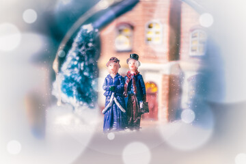 Dummys of a couple un a village landscape in winter