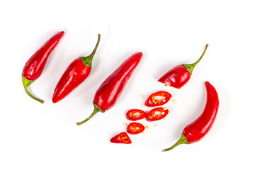 Hot chili peppers on white background isolated, top view, flat lay.