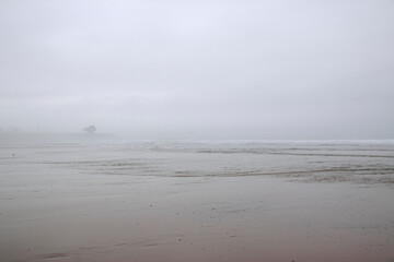 Empty foggy beach