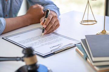 Attorney or Judge gavel with Justice lawyers sign contract , Business man  or lawyer working on a documents. Legal law and is consulting and legal advice, advice and justice concept.