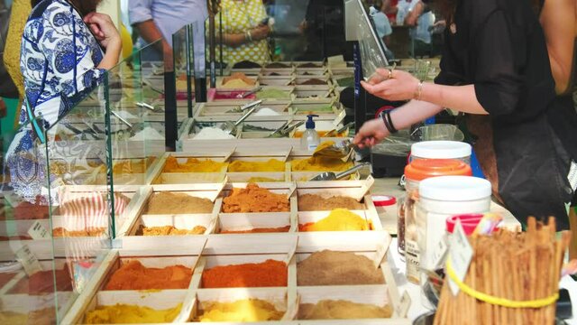 yellow spice customer women shop market stall