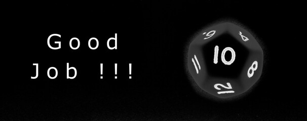 Twelve sided dice with number ten and message good job on black background 