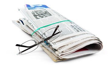 Eyeglasses On Bunch Of Newspapers