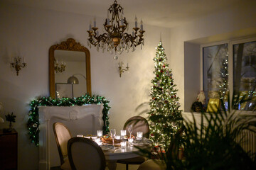Beautiful holdiay decorated room with Christmas tree with presents under it