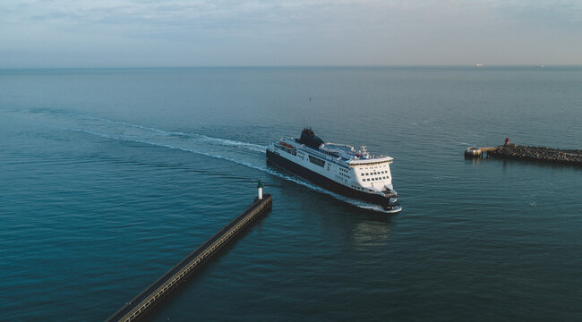 A Passenger Ferry Crossing the Sea and Arriving into Port
