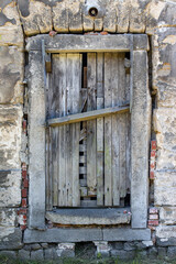 A damaged door in an abandoned building