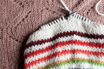 knitting a striped beanie hat on circular knitting needles