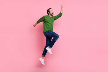 Full size profile photo of cheerful excited young man look empty space isolated on pink color...