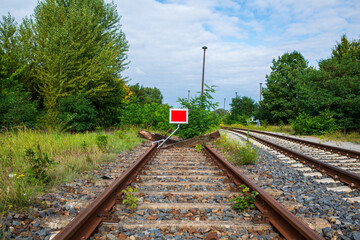 Dead End. The path that leads nowhere. Barrier at the end of a railroad track. 